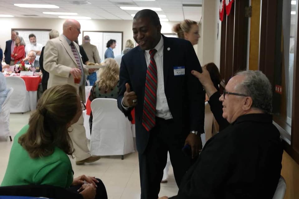 Jason Knight speaking with community members